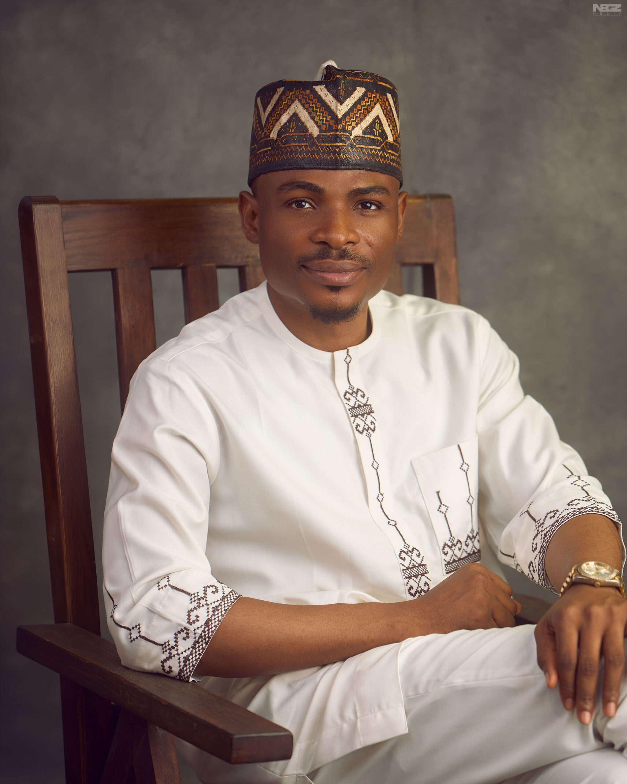 Portrait of James Kure, the groom, dressed elegantly for the Blossom 2026 wedding